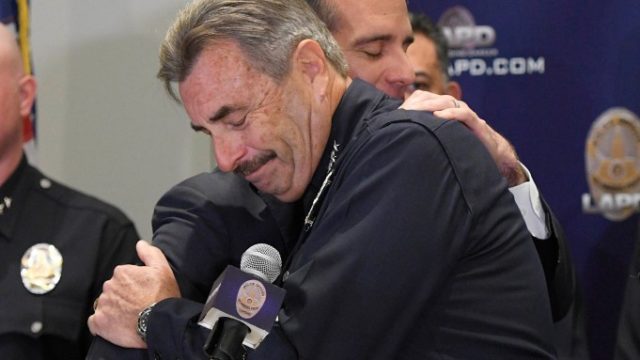LA Mayor Eric Garcetti and LAPD Chief Charlie Beck embrace at a press conference
