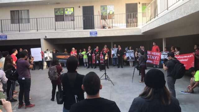 tenants and supporters hold a press conference in the courtyard of 1815 E 2nd street