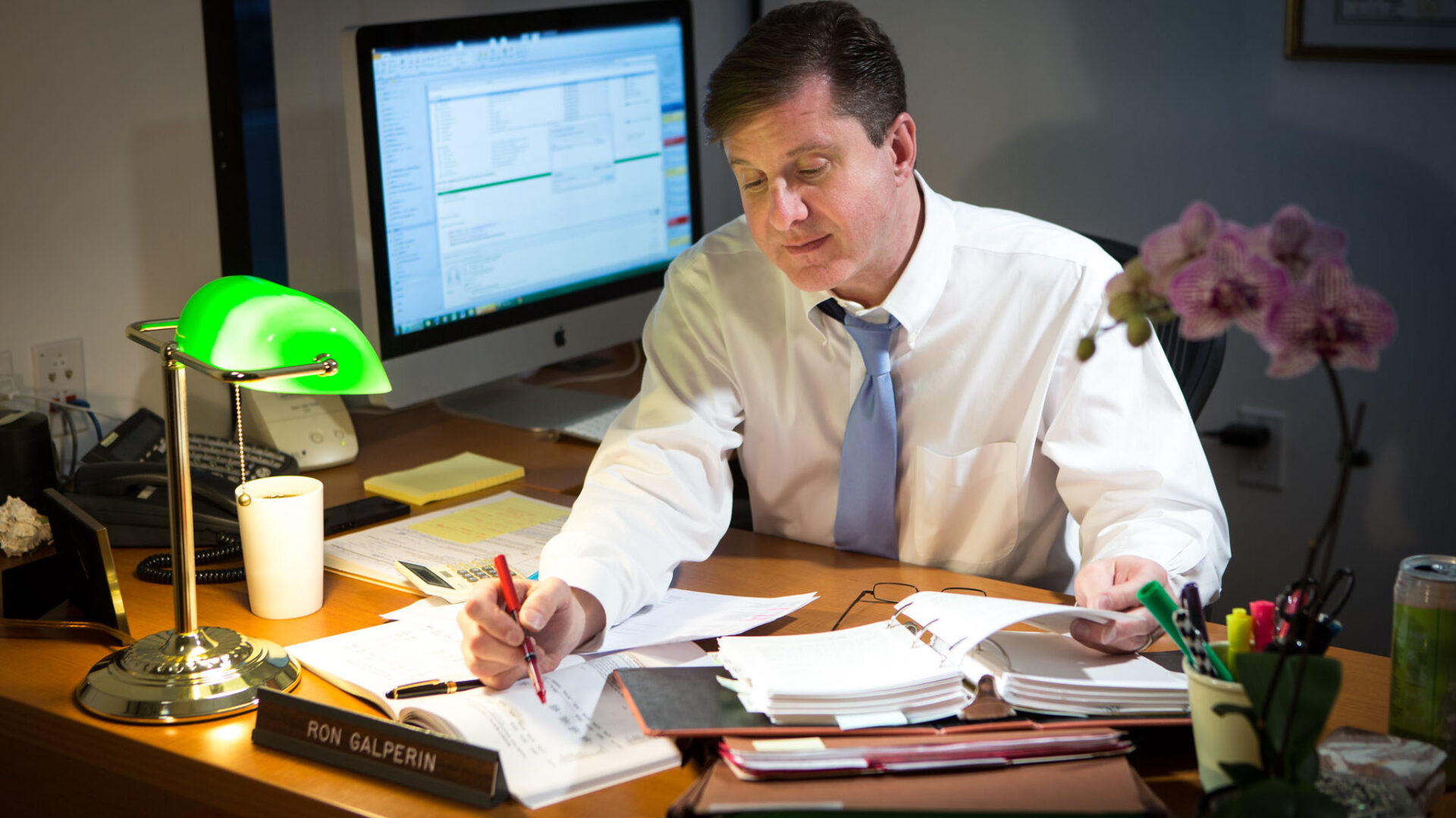 Ron Galperin, City Controller of Los Angeles, sits at his desk.