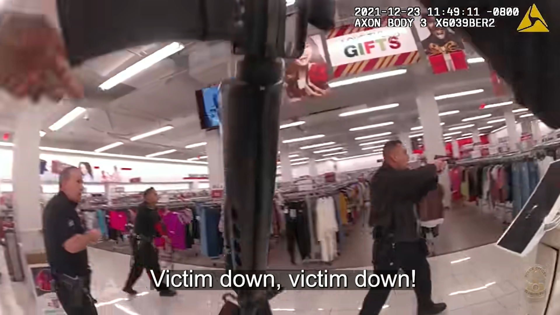 Camera footage of Officers beginning to move toward Daniel Elena Lopez in a store