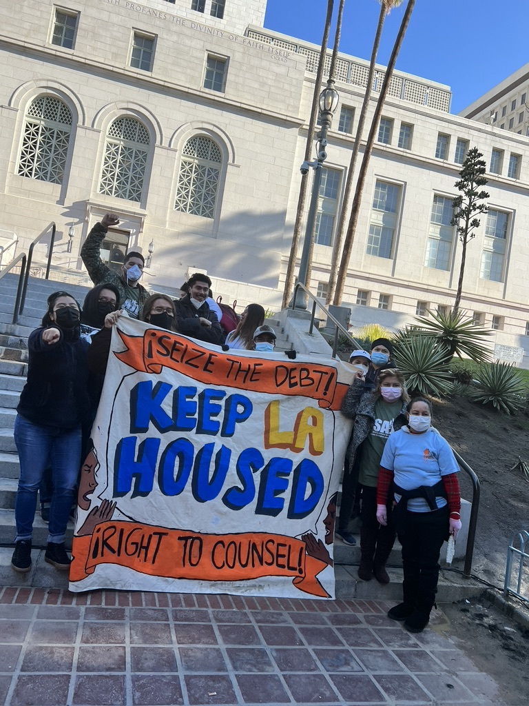 Housing rights activists demanding the right to counsel for tenants outside of of city hall