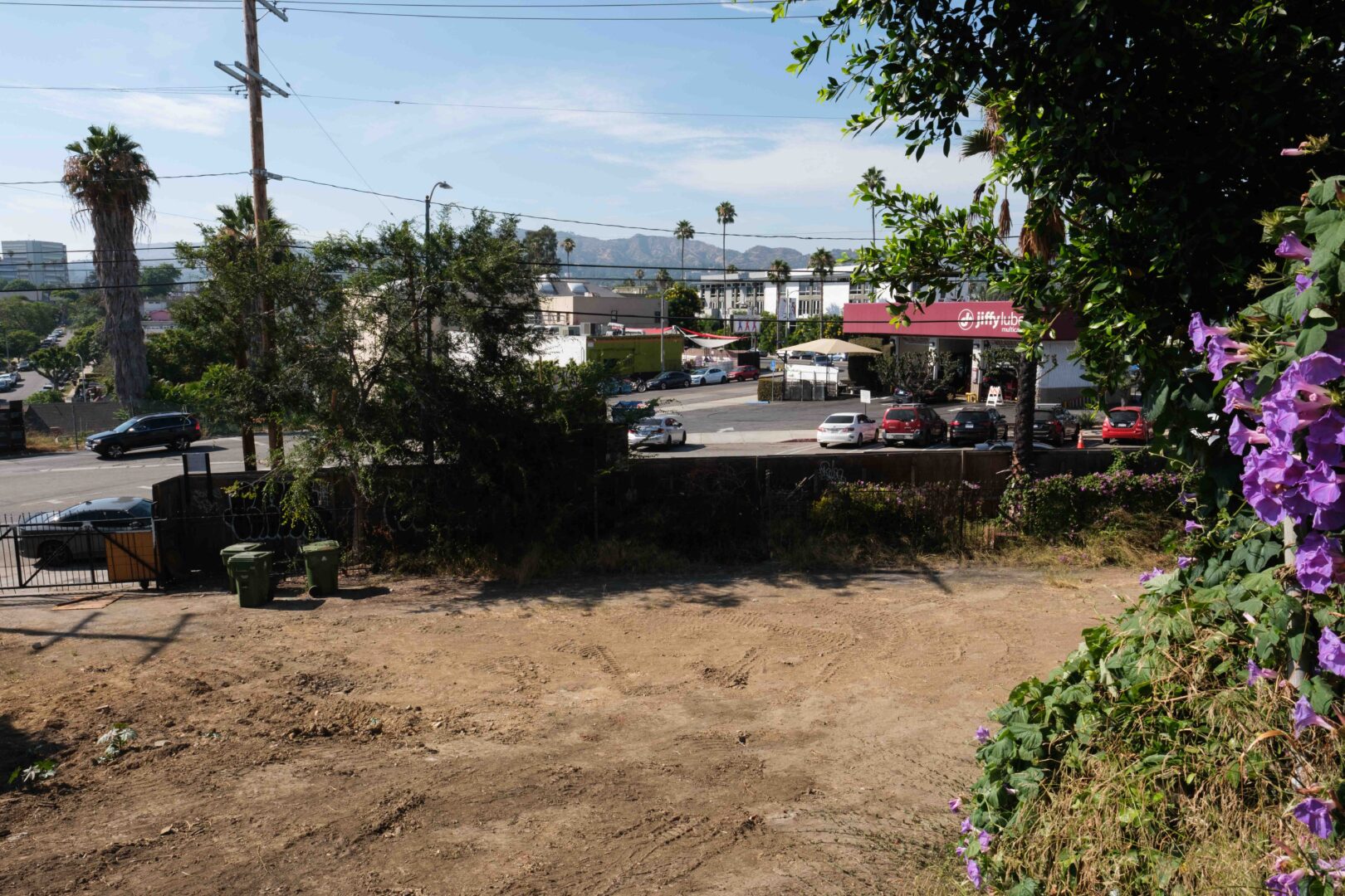 Adjacent to AgLago, an empty lot sits where previously, historical buildings were demolished by Frost/Chaddock Developers, LLC. July 2023.